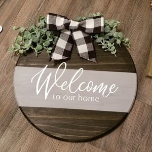 "Welcome to our home" sign